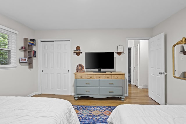 3488 Elmendorf Way, Lexington, KY 40517 - bedroom with light wood finished floors, baseboards, and a closet
