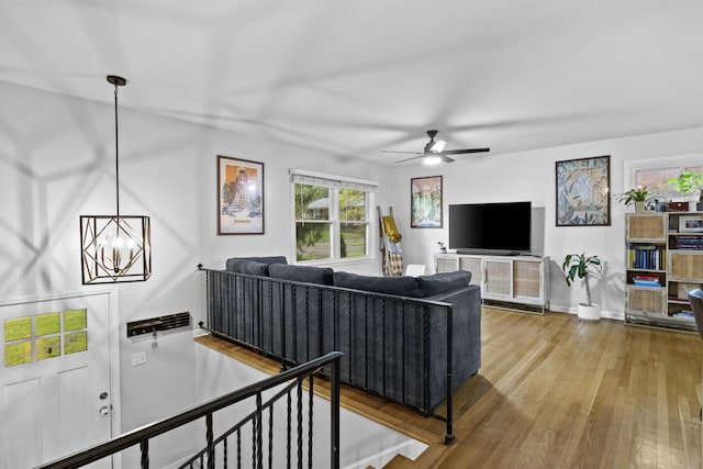 3488 Elmendorf Way, Lexington, KY 40517 - living room featuring wood finished floors, ceiling fan, a chandelier, and baseboards