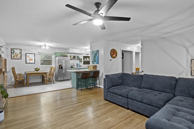 3488 Elmendorf Way, Lexington, KY 40517 - living area featuring light wood-type flooring, a ceiling fan, and baseboards