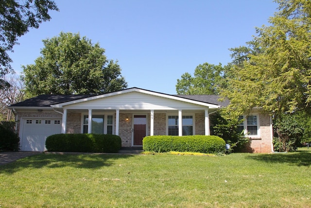 565 Cecil Way, Lexington, KY 40503 - view of front of home featuring brick siding, an attached garage, a front yard, and asphalt driveway