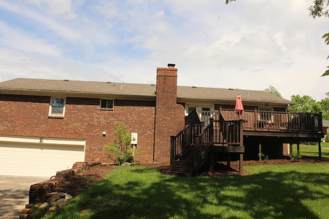 back of house with a garage, concrete driveway, a deck, a chimney, and a lawn