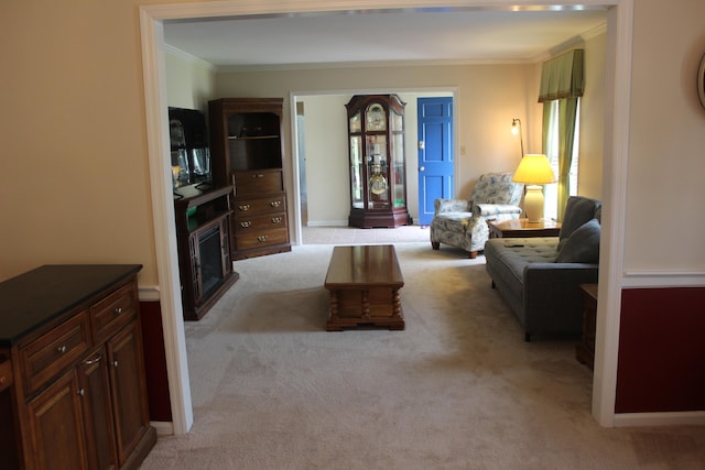 living room with crown molding and light colored carpet
