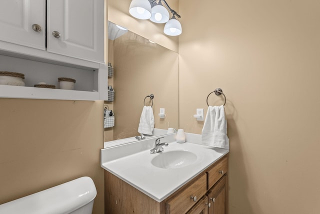 half bath with toilet and vanity