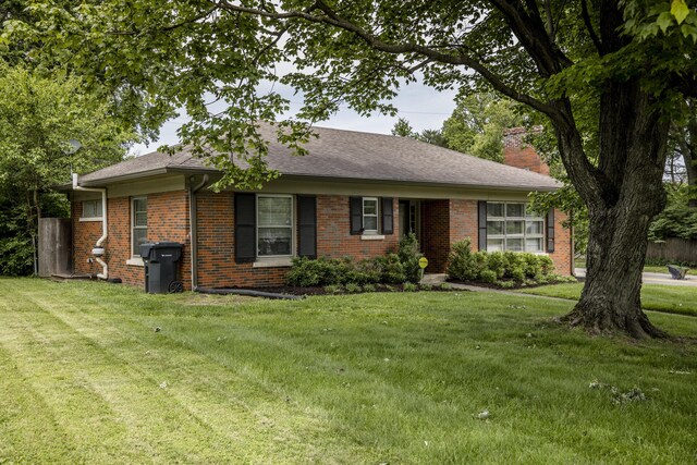 3401 Bellefonte Dr, Lexington, KY 40502 - ranch-style home featuring brick siding, a chimney, a front yard, and roof with shingles