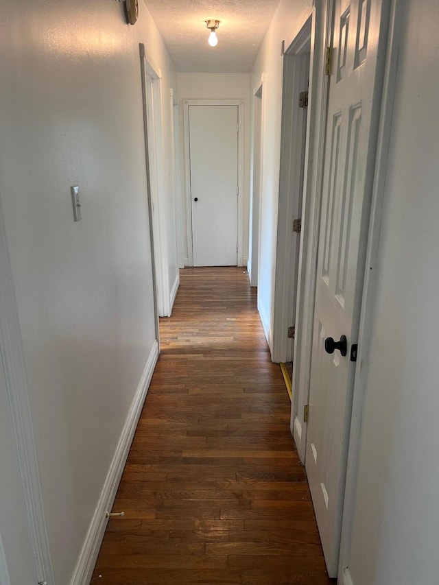 104 Arvin Dr, Lancaster, KY 40444 - hallway with baseboards and wood finished floors