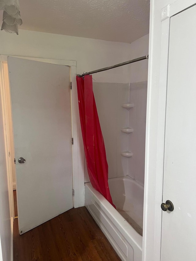 104 Arvin Dr, Lancaster, KY 40444 - bathroom featuring wood finished floors and shower / bath combination with curtain