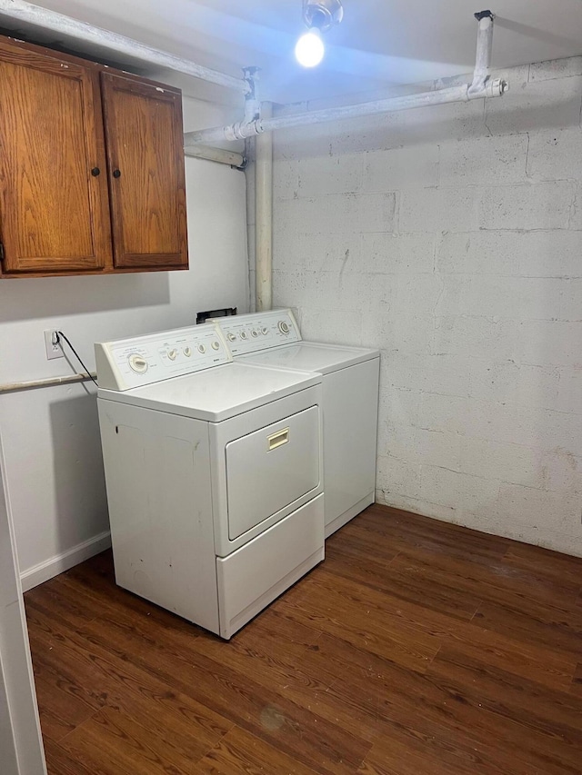 104 Arvin Dr, Lancaster, KY 40444 - washroom with washing machine and clothes dryer, dark wood-style floors, and cabinet space