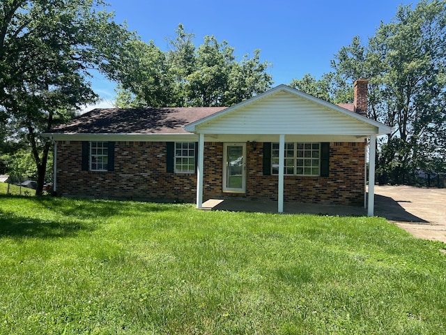 104 Arvin Dr, Lancaster, KY 40444 - ranch-style home featuring a chimney, a front lawn, brick siding, and a porch