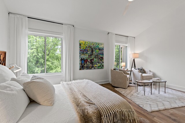 543 Laketower Dr Unit 140, Lexington, KY 40502 - bedroom with wood finished floors, vaulted ceiling, and baseboards