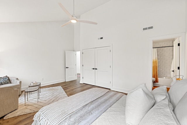 543 Laketower Dr Unit 140, Lexington, KY 40502 - bedroom with high vaulted ceiling, wood finished floors, baseboards, connected bathroom, and a ceiling fan