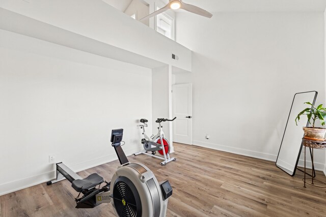 543 Laketower Dr Unit 140, Lexington, KY 40502 - exercise room featuring a towering ceiling, baseboards, wood finished floors, and ceiling fan