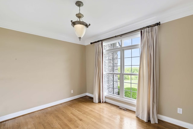 4301 Ravens Crest Ln, Lexington, KY 40515 - empty room featuring baseboards, light wood finished floors, and ornamental molding