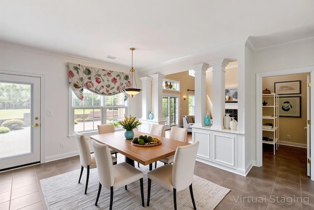 4301 Ravens Crest Ln, Lexington, KY 40515 - dining space featuring dark tile patterned floors, plenty of natural light, ornamental molding, and ornate columns