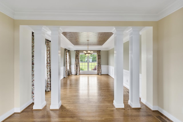 4301 Ravens Crest Ln, Lexington, KY 40515 - unfurnished room featuring wood finished floors, a chandelier, and ornamental molding