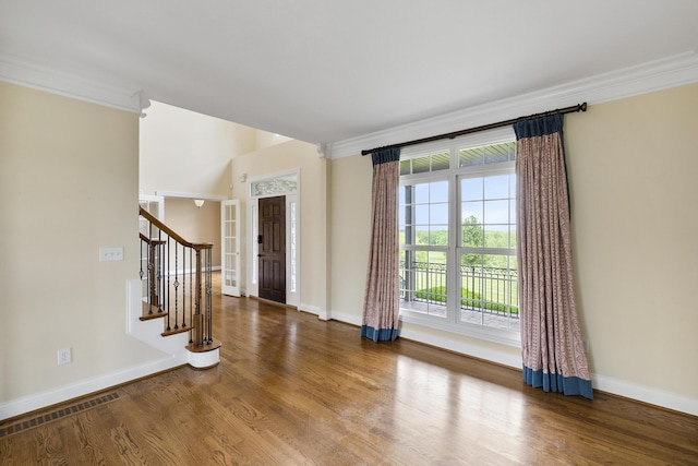 4301 Ravens Crest Ln, Lexington, KY 40515 - entrance foyer with baseboards, wood finished floors, ornamental molding, and stairs