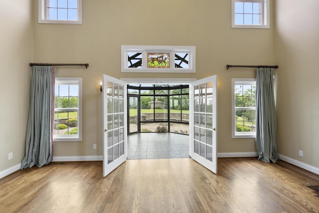 4301 Ravens Crest Ln, Lexington, KY 40515 - entrance foyer featuring french doors, a towering ceiling, baseboards, and healthy amount of natural light