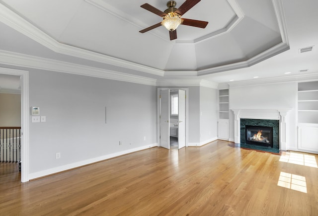 4301 Ravens Crest Ln, Lexington, KY 40515 - unfurnished living room with a raised ceiling, ceiling fan, light wood finished floors, baseboards, and a fireplace