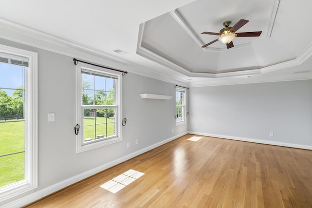 4301 Ravens Crest Ln, Lexington, KY 40515 - unfurnished room featuring a tray ceiling, crown molding, ceiling fan, light wood-type flooring, and baseboards