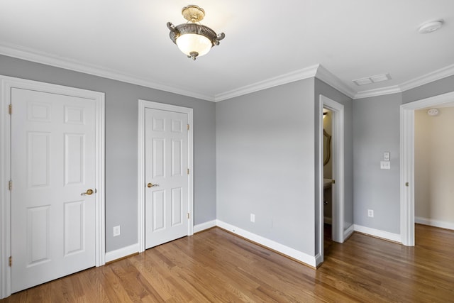4301 Ravens Crest Ln, Lexington, KY 40515 - unfurnished bedroom featuring wood finished floors, baseboards, and crown molding