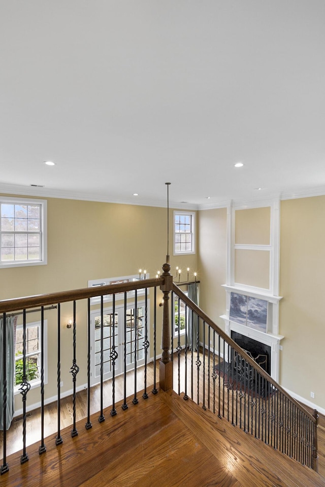 4301 Ravens Crest Ln, Lexington, KY 40515 - stairs with wood finished floors, ornamental molding, a fireplace, baseboards, and recessed lighting