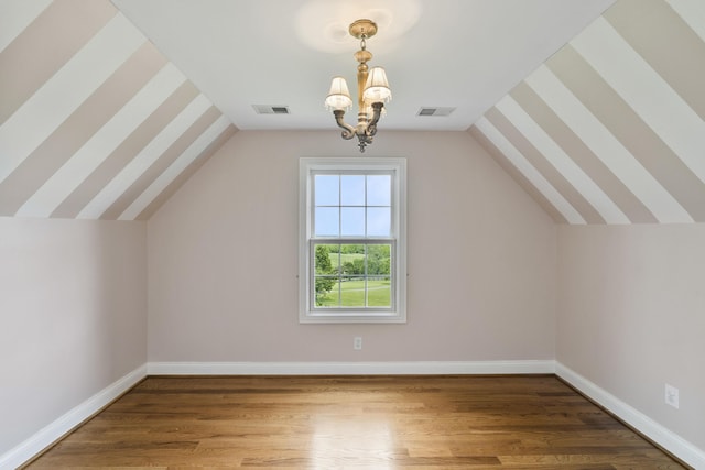 4301 Ravens Crest Ln, Lexington, KY 40515 - additional living space featuring a chandelier, wood finished floors, baseboards, and lofted ceiling