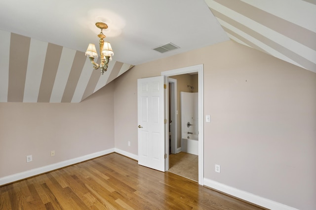 4301 Ravens Crest Ln, Lexington, KY 40515 - bonus room with lofted ceiling, a chandelier, light wood-style flooring, and baseboards