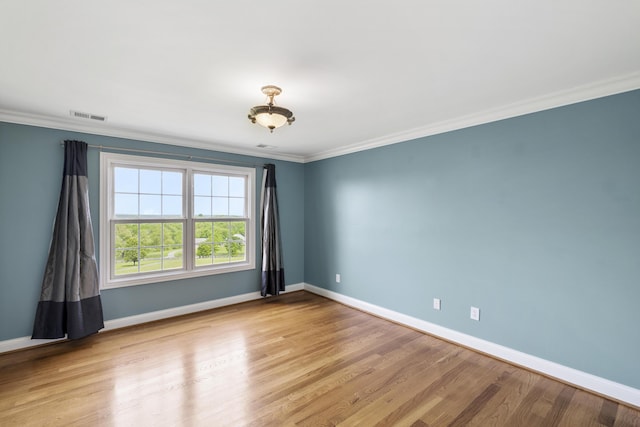 4301 Ravens Crest Ln, Lexington, KY 40515 - unfurnished room with crown molding, wood finished floors, and baseboards