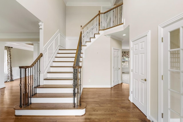 4301 Ravens Crest Ln, Lexington, KY 40515 - staircase with wood finished floors, a towering ceiling, and crown molding