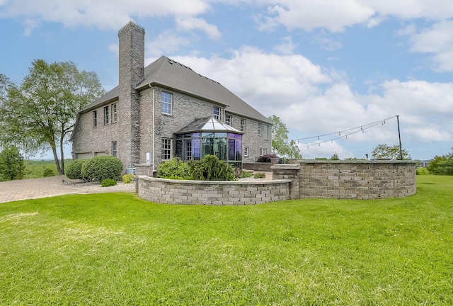 4301 Ravens Crest Ln, Lexington, KY 40515 - rear view of house featuring a gazebo, a chimney, a yard, and brick siding
