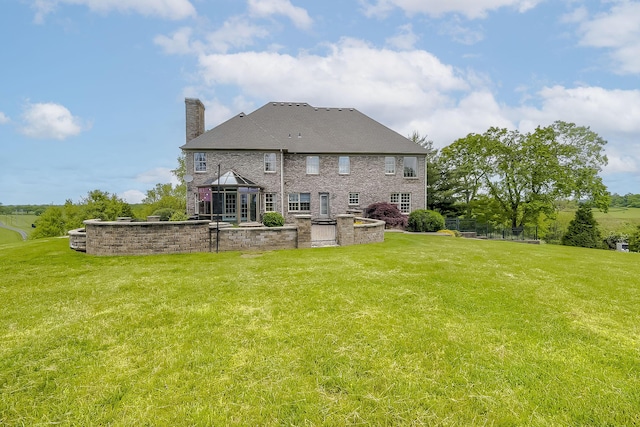 4301 Ravens Crest Ln, Lexington, KY 40515 - rear view of property with a chimney and a yard