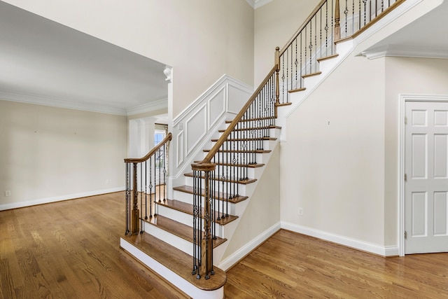 4301 Ravens Crest Ln, Lexington, KY 40515 - staircase with wood finished floors, crown molding, and baseboards