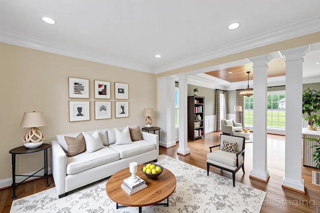 4301 Ravens Crest Ln, Lexington, KY 40515 - living area featuring decorative columns, ornamental molding, wood finished floors, recessed lighting, and a wainscoted wall