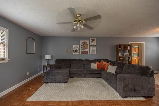 1667 Strader Dr, Lexington, KY 40505 - living area with a ceiling fan, a textured ceiling, and baseboards