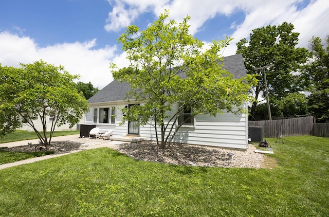 1667 Strader Dr, Lexington, KY 40505 - view of property hidden behind natural elements with roof with shingles and a patio area