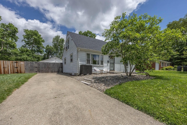 1667 Strader Dr, Lexington, KY 40505 - view of front of house with roof with shingles, a gate, and concrete driveway
