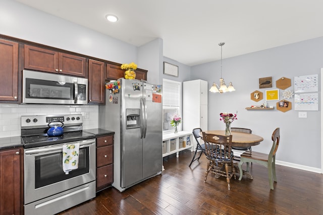2768 Red Clover Ln, Lexington, KY 40511 - kitchen featuring stainless steel appliances, a chandelier, backsplash, dark wood-type flooring, and baseboards
