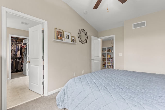 2768 Red Clover Ln, Lexington, KY 40511 - bedroom featuring vaulted ceiling, a walk in closet, a closet, a ceiling fan, and light carpet