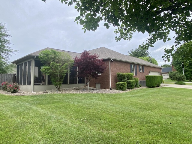 319 Huckleberry Ln, London, KY 40744 - rear view of property with a sunroom, a yard, brick siding, and a garage
