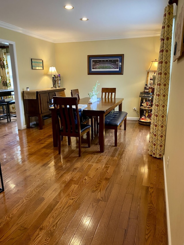 319 Huckleberry Ln, London, KY 40744 - dining space featuring dark wood-style flooring, crown molding, recessed lighting, and baseboards