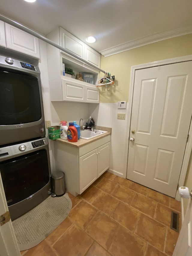 319 Huckleberry Ln, London, KY 40744 - washroom with stacked washer / drying machine, ornamental molding, and cabinet space
