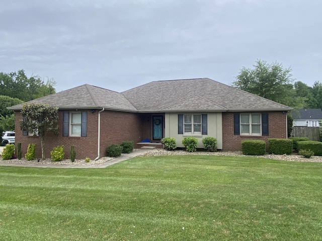 319 Huckleberry Ln, London, KY 40744 - ranch-style home with brick siding, a front yard, and roof with shingles
