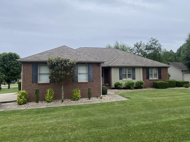 319 Huckleberry Ln, London, KY 40744 - view of front facade with a shingled roof, a front lawn, and brick siding