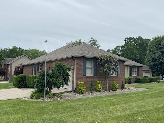 319 Huckleberry Ln, London, KY 40744 - view of side of property featuring brick siding, a yard, and a shingled roof