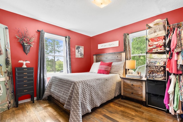 bedroom with wood finished floors
