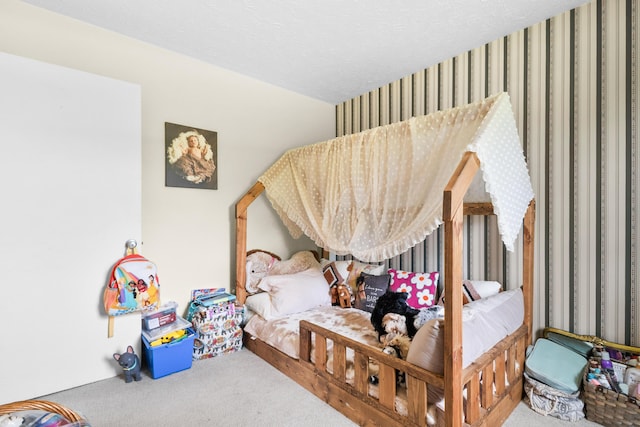 bedroom featuring carpet floors and wallpapered walls