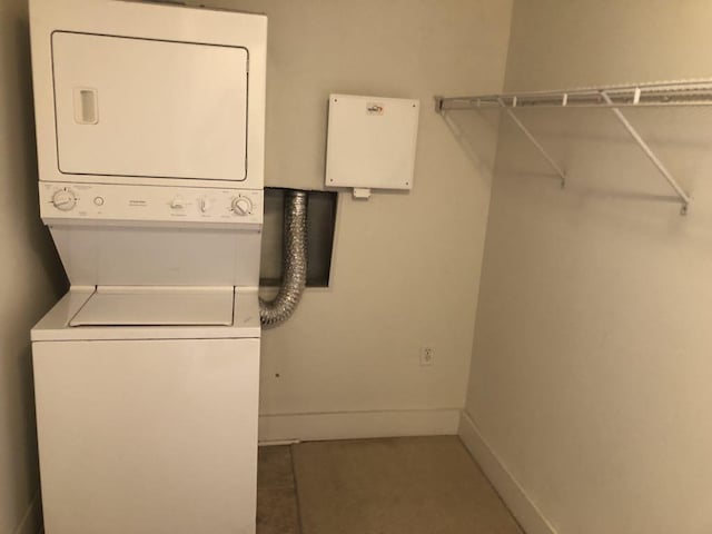 535 S Upper St Unit 317, Lexington, KY 40508 - laundry room with stacked washer and clothes dryer and baseboards