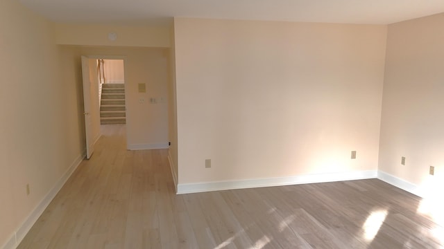 1667 Snow Goose Cir, Lexington, KY 40511 - spare room featuring light wood-style floors, stairway, and baseboards
