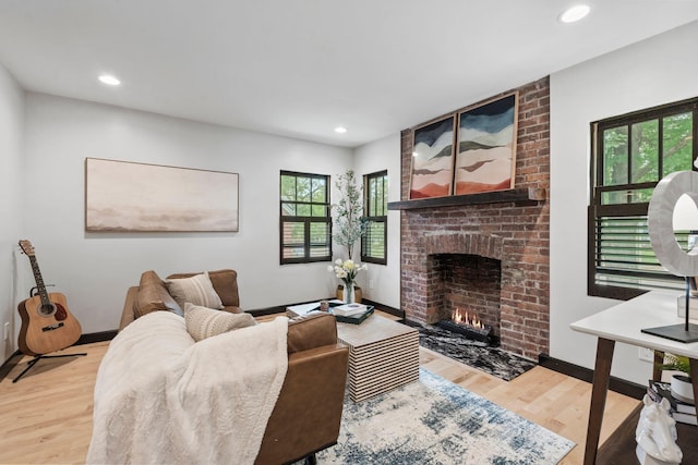 252 Cochran Rd, Lexington, KY 40502 - living area featuring wood finished floors, a brick fireplace, baseboards, and recessed lighting