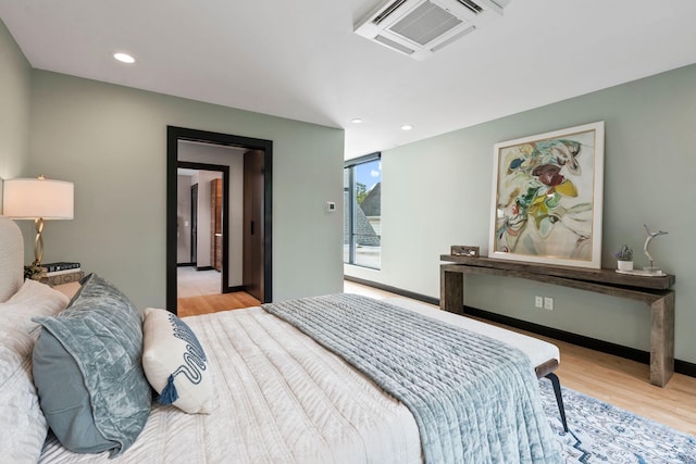 252 Cochran Rd, Lexington, KY 40502 - bedroom with light wood finished floors, access to exterior, and recessed lighting