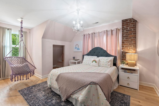 252 Cochran Rd, Lexington, KY 40502 - bedroom with baseboards, a chandelier, light wood finished floors, and lofted ceiling
